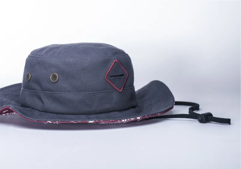 Bucket hats custom made with sustainable organic cotton, brass eyelets, and adjustable chin strap for wholesale brand orders