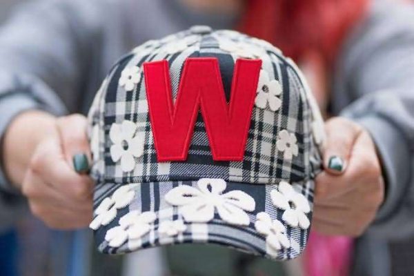 Premium 6-Panel Baseball Cap with a finely embroidered "W" logo, surrounded by a detailed and vibrant all-over floral print design.