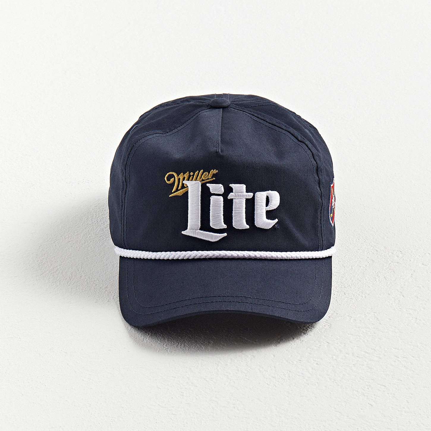 Front view of the Miller Light Golf Hat with 3D embroidery logo and rope detail by Boldhatmaker