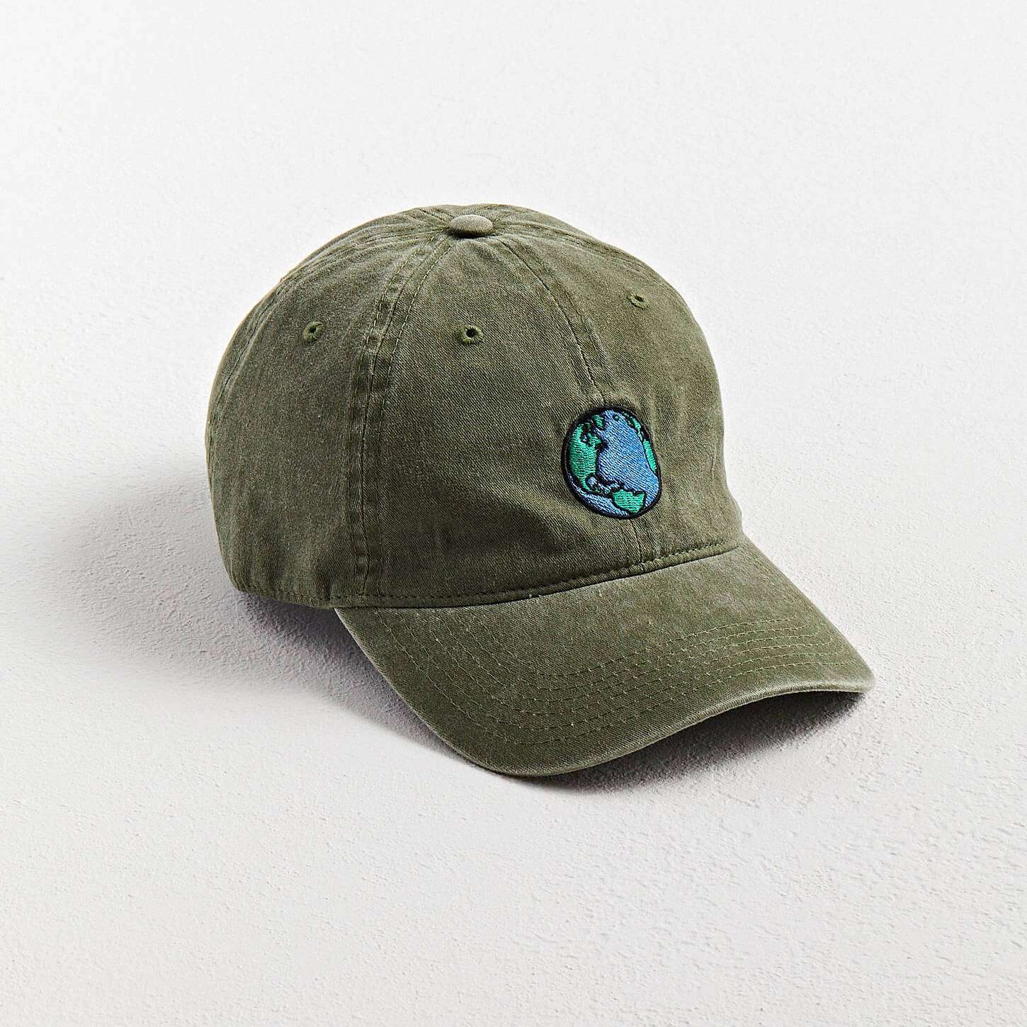 Side view of the washed cotton 6-panel baseball cap with curved brim and breathable stitched grommets.