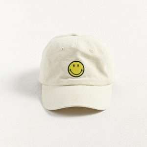 Side view of 5 panel smiley dad hat made from stone-washed cotton canvas.
