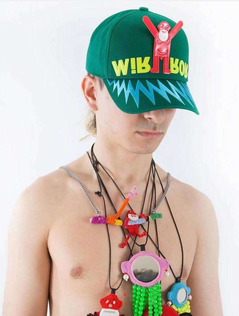 Green structured baseball cap with 3D puff embroidery, rubber monkey appliqué, and zig-zag screen print brim, bold streetwear style