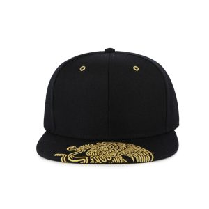 Front view of a black 6-panel structured flat bill snapback featuring gold metallic embroidery on the visor and gold metal grommets.