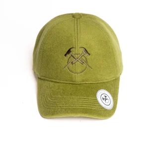 Direct front view of an olive green wool melton 6-panel dad hat showing crisp tonal high-density embroidery of crossed hammers and lightning bolts on textured felt, with a white brim sticker.